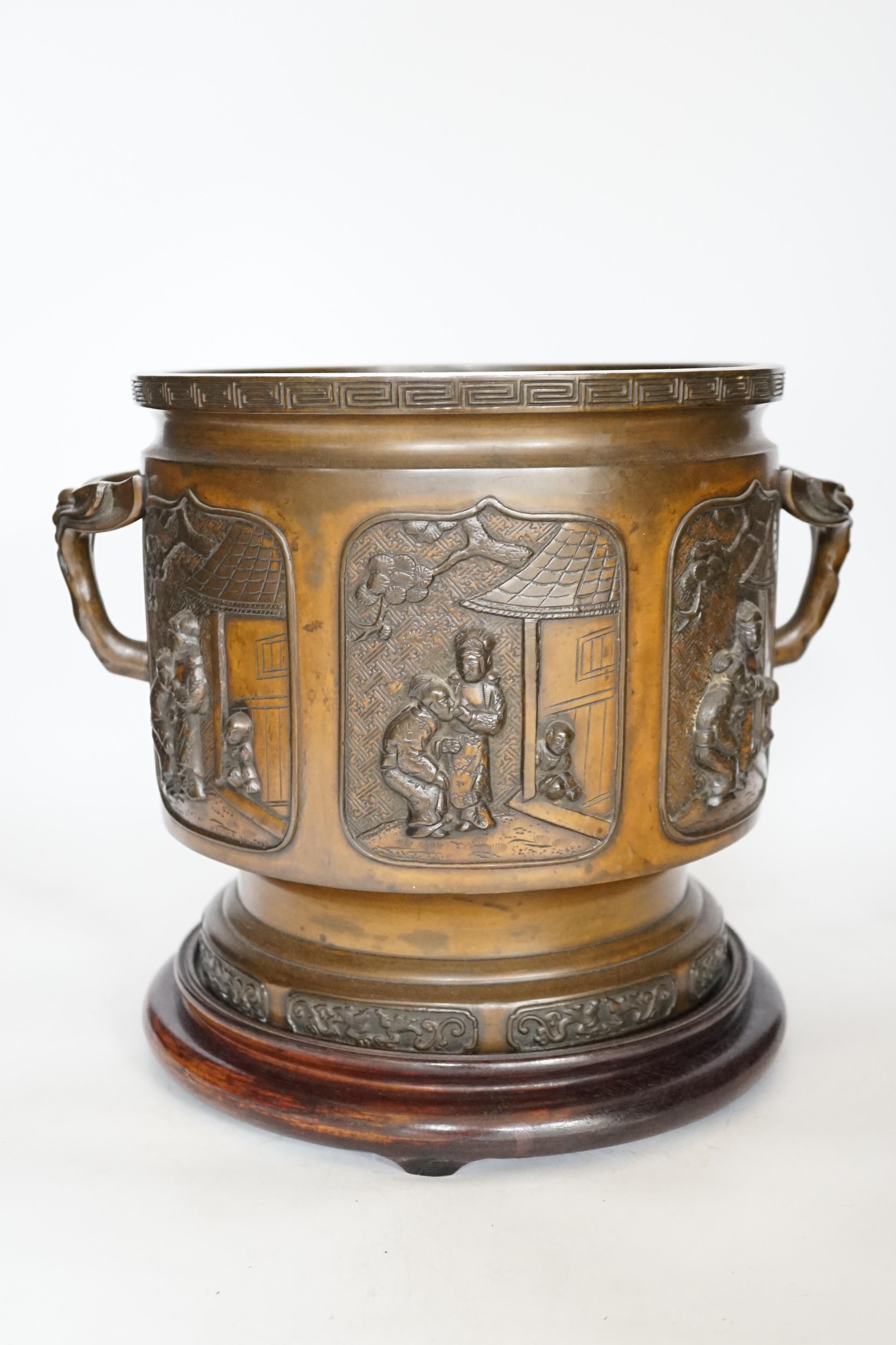 A large 19th century Japanese bronze two handled censer on stand, 28cm high